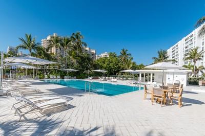 609 Ocean Drive, Unit 8G Key Biscayne, FL 33149 - Photo 36 of 44 a view of a house with backyard porch and sitting area