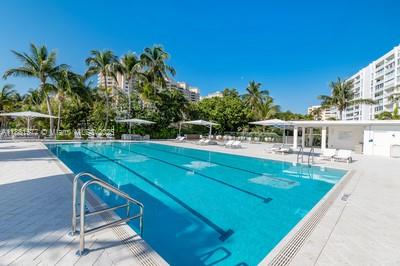 609 Ocean Drive, Unit 8G Key Biscayne, FL 33149 - Photo 40 of 44 a view of a swimming pool with a patio