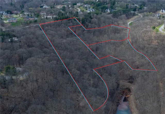 an aerial view of a highlighted house