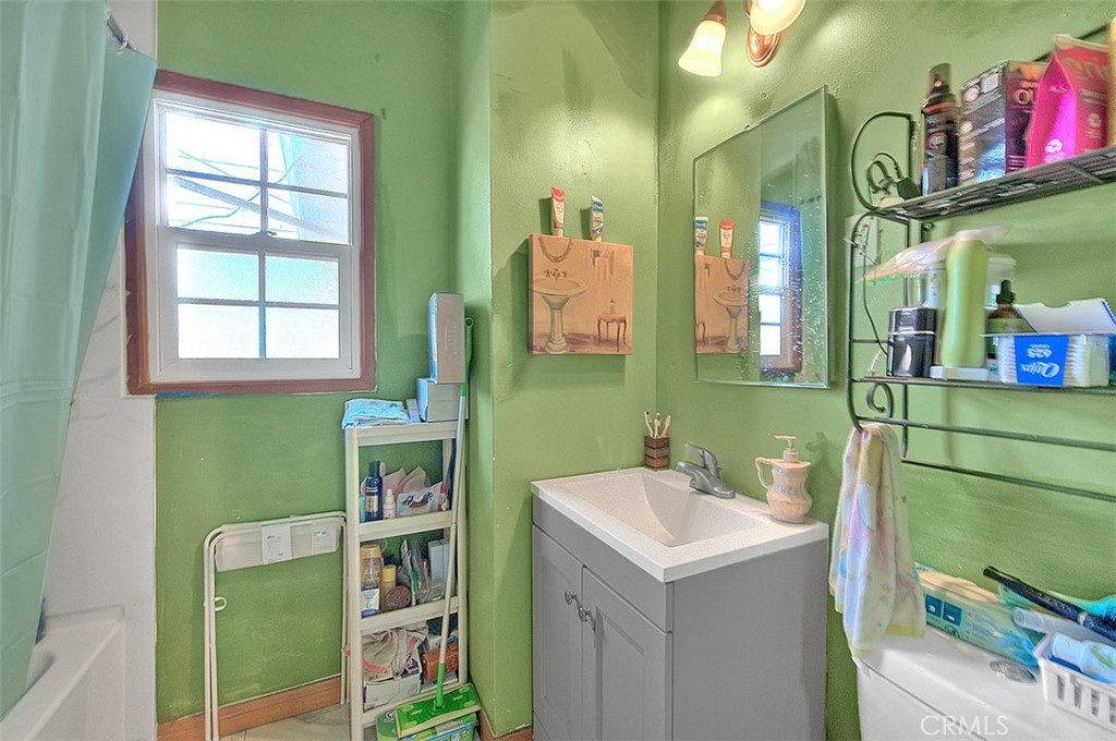 8651 Encinitas Avenue Fontana, CA 92335 - Photo 19 of 35 a bathroom with a sink and a mirror