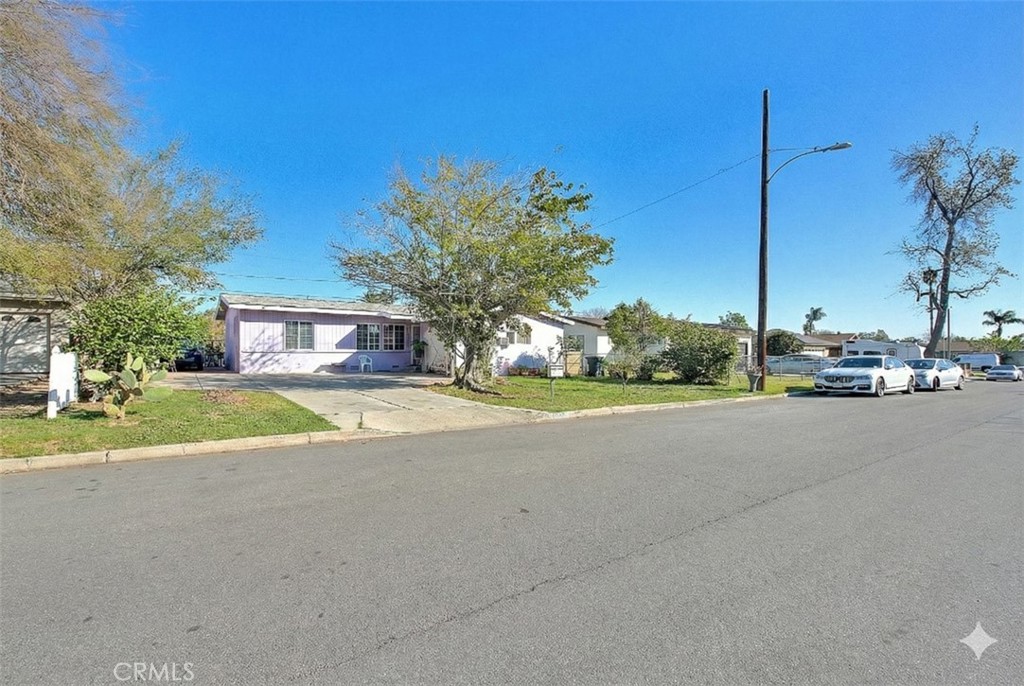 8651 Encinitas Avenue Fontana, CA 92335 - Photo 2 of 35 a view of a street with houses on the side