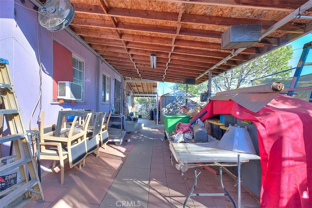 8651 Encinitas Avenue Fontana, CA 92335 - Photo 22 of 35 a patio with glass top table and chairs