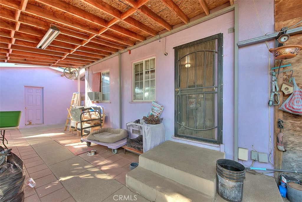 8651 Encinitas Avenue Fontana, CA 92335 - Photo 25 of 35 a building outdoor space with patio furniture and potted plants