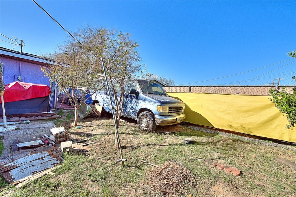 8651 Encinitas Avenue Fontana, CA 92335 - Photo 30 of 35 a view of a yard with wooden fence