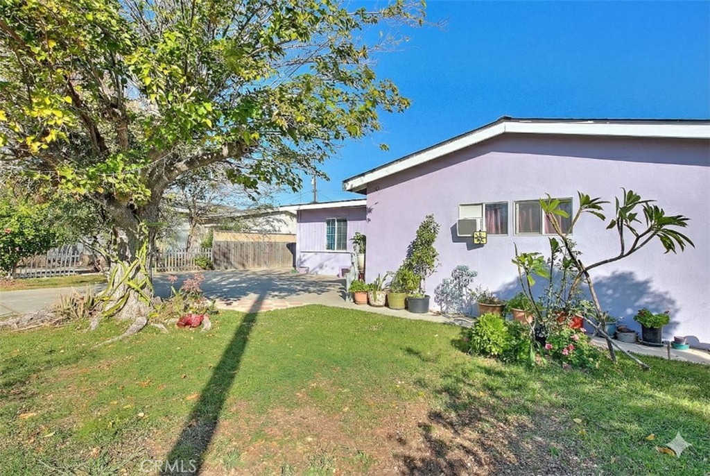 8651 Encinitas Avenue Fontana, CA 92335 - Photo 3 of 35 a front view of a house with garden