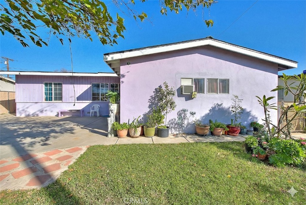 8651 Encinitas Avenue Fontana, CA 92335 - Photo 5 of 35 a front view of a house with a yard