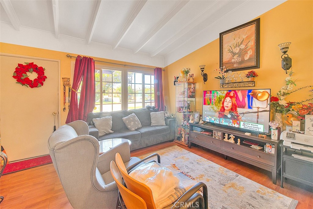8651 Encinitas Avenue Fontana, CA 92335 - Photo 7 of 35 a living room with furniture and a flat screen tv