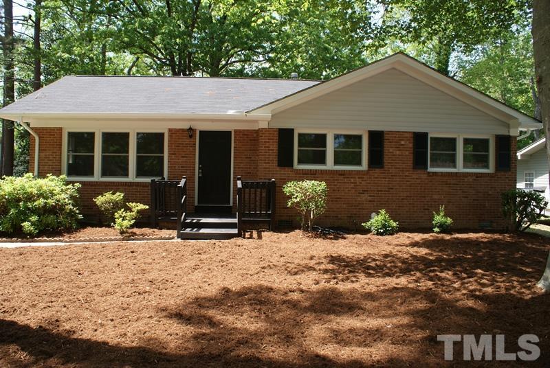 504 Cooper Road Raleigh, NC 27610 - Photo 1 of 21 a front view of a house with a yard and outdoor seating