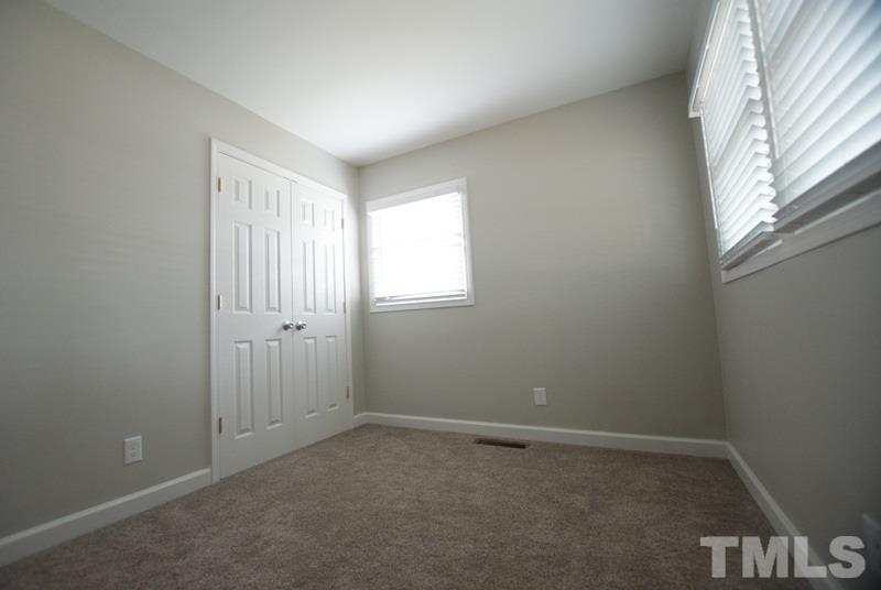 504 Cooper Road Raleigh, NC 27610 - Photo 12 of 21 an empty room with windows