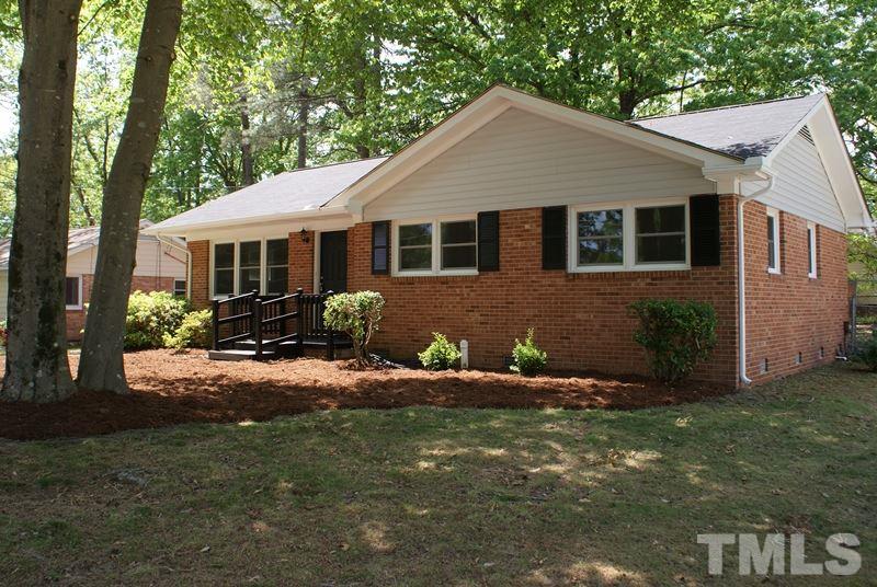 504 Cooper Road Raleigh, NC 27610 - Photo 21 of 21 a front view of a house with a yard and outdoor seating