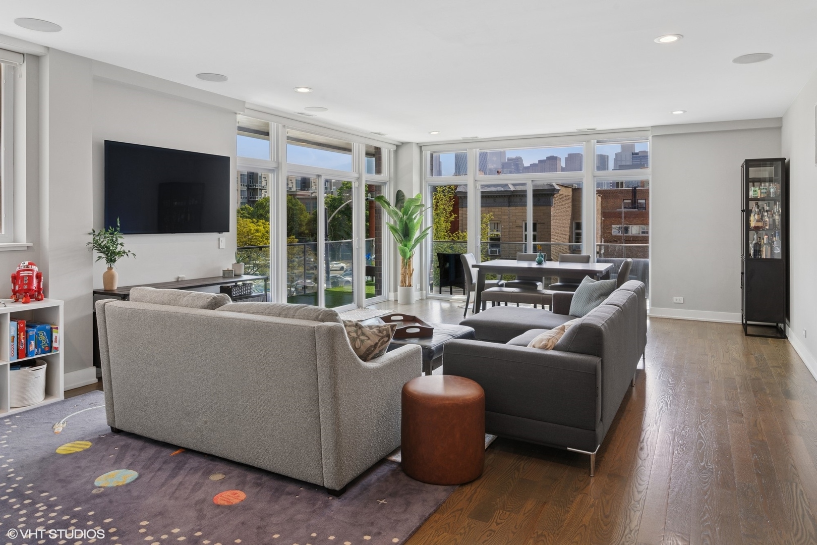 236 South Racine Avenue, Unit 304 Chicago, IL 60607 - Photo 2 of 19 a living room with furniture and a flat screen tv