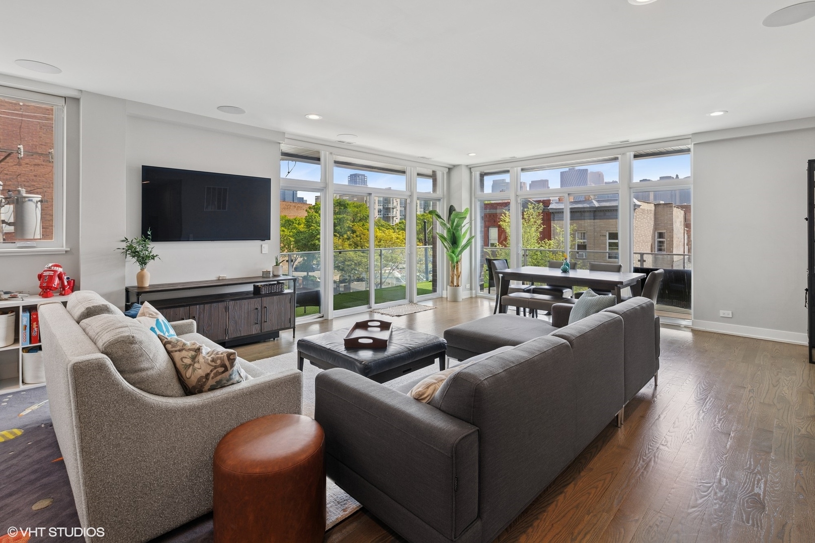 236 South Racine Avenue, Unit 304 Chicago, IL 60607 - Photo 3 of 19 a living room with furniture and a flat screen tv