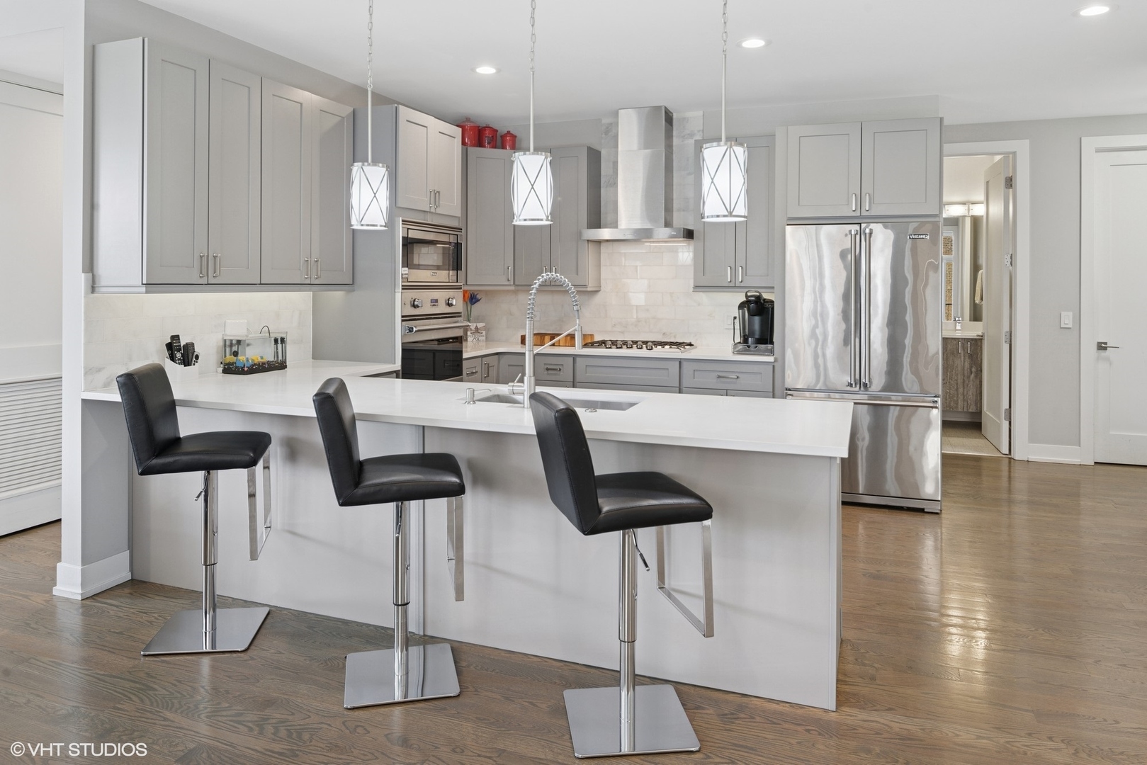 236 South Racine Avenue, Unit 304 Chicago, IL 60607 - Photo 6 of 19 a kitchen with stainless steel appliances kitchen island granite countertop a refrigerator and cabinets