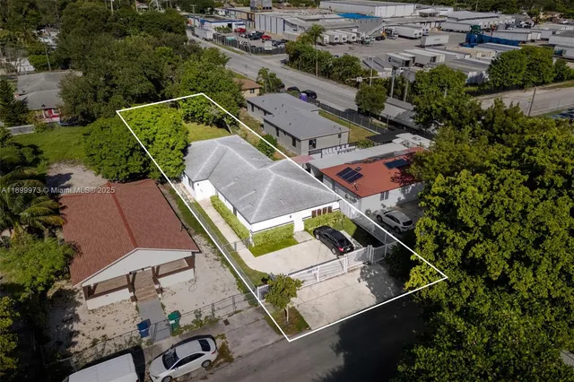 an aerial view of a house with a garden