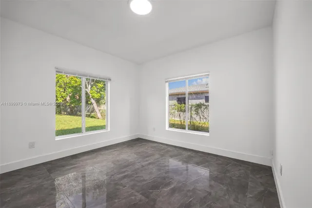 an empty room with windows