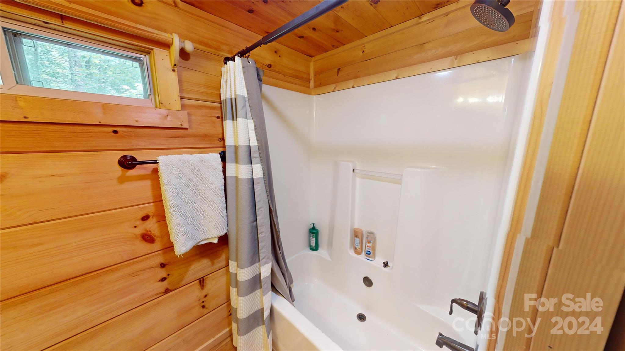 78 Smiling Fox Trail Brevard, NC 28712 - Photo 21 of 22 a bathroom with a bathtub and a shower