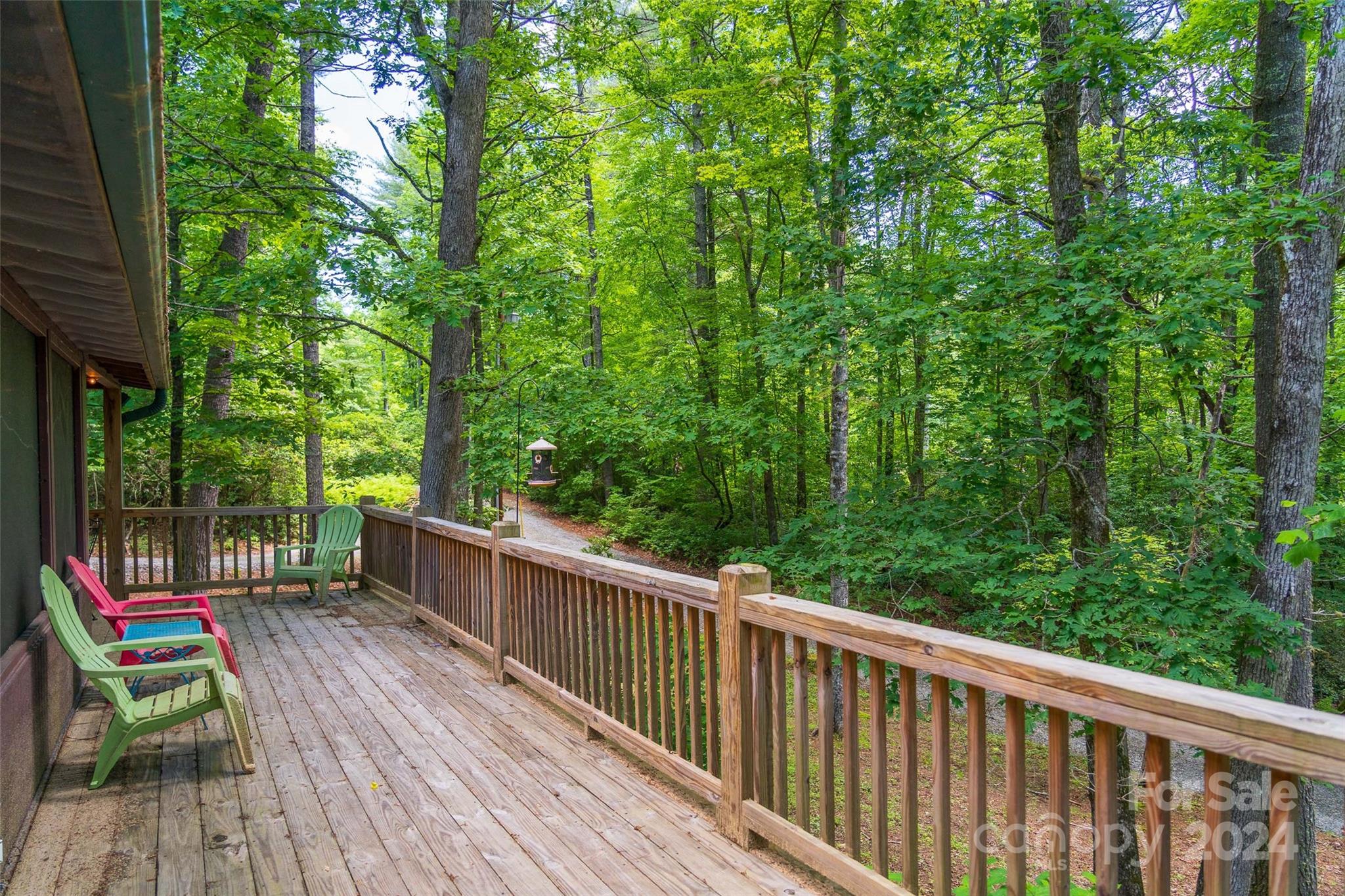78 Smiling Fox Trail Brevard, NC 28712 - Photo 3 of 22 a view of a wooden deck next to a yard