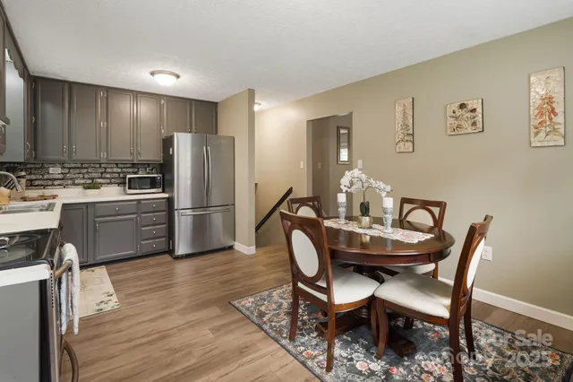 a view of a dining room with furniture and window