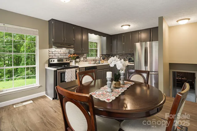 a kitchen with a stove a sink and a refrigerator
