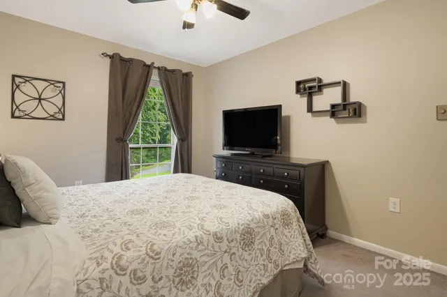 a bathroom with a sink and mirror with toilet