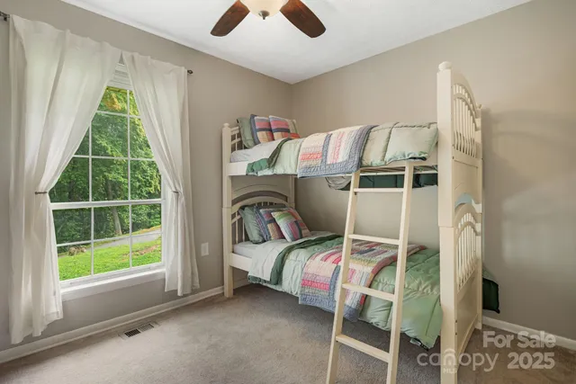 a bedroom with a bed and a cabinets