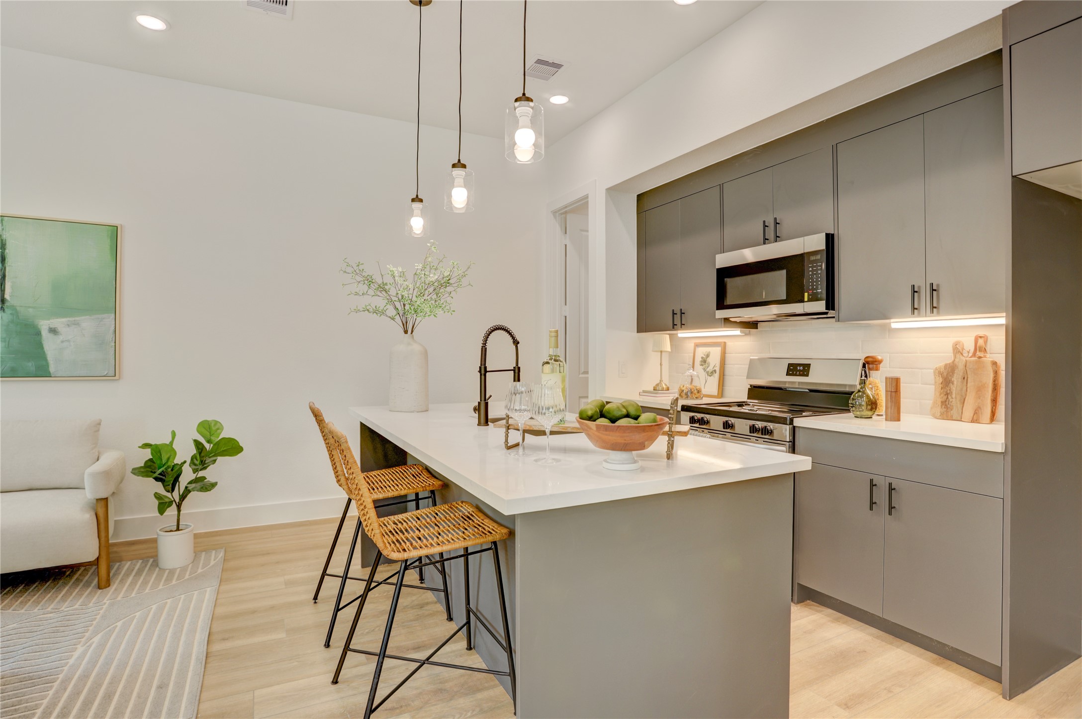 9604 Burden Street Houston, TX 77093 - Photo 13 of 28 The 10x15 SF kitchen has 3cm quartz counters and top-of-the-line Frigidaire stainless steel appliances.