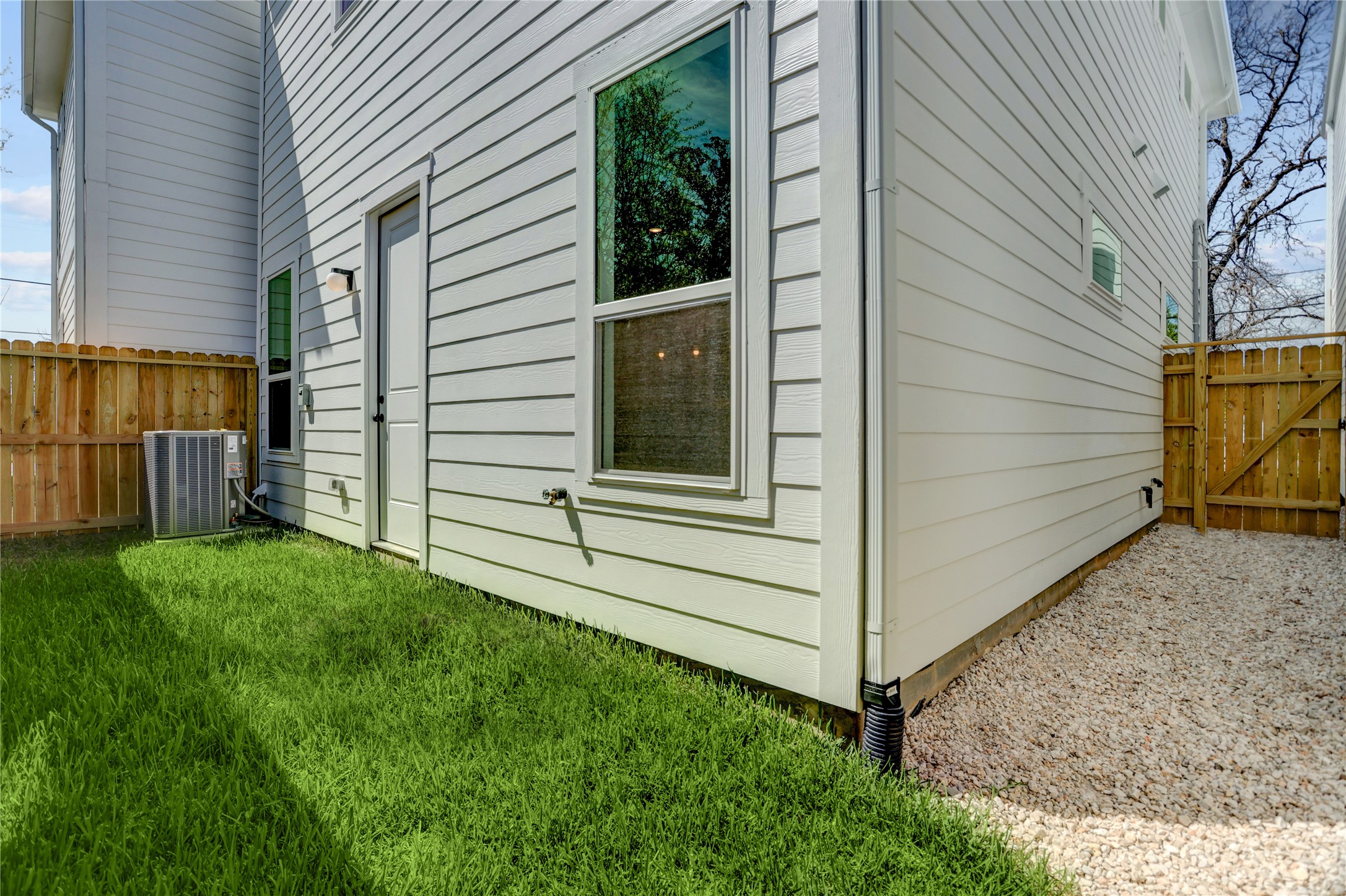 9604 Burden Street Houston, TX 77093 - Photo 25 of 28 The home has a fully fenced low maintenance green space and gravel side yard.