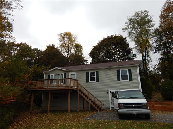 19 Wrentham Road Worcester, MA 01602 - Photo 2 of 12 a view of a house with a deck and a yard