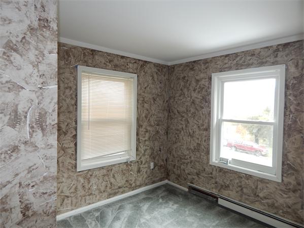 19 Wrentham Road Worcester, MA 01602 - Photo 8 of 12 an empty room with a window