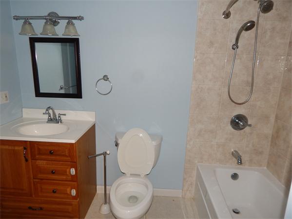 19 Wrentham Road Worcester, MA 01602 - Photo 10 of 12 a bathroom with a sink a toilet and shower