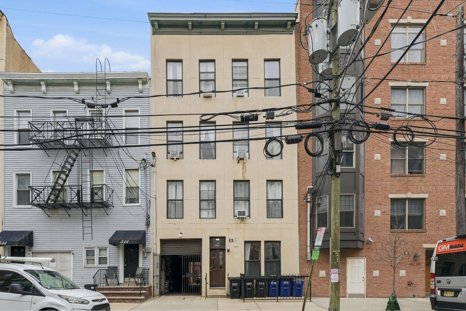 509 Monroe Street, Unit 3L Hoboken, NJ 07030 - Photo 2 of 18 a front view of a building with a street