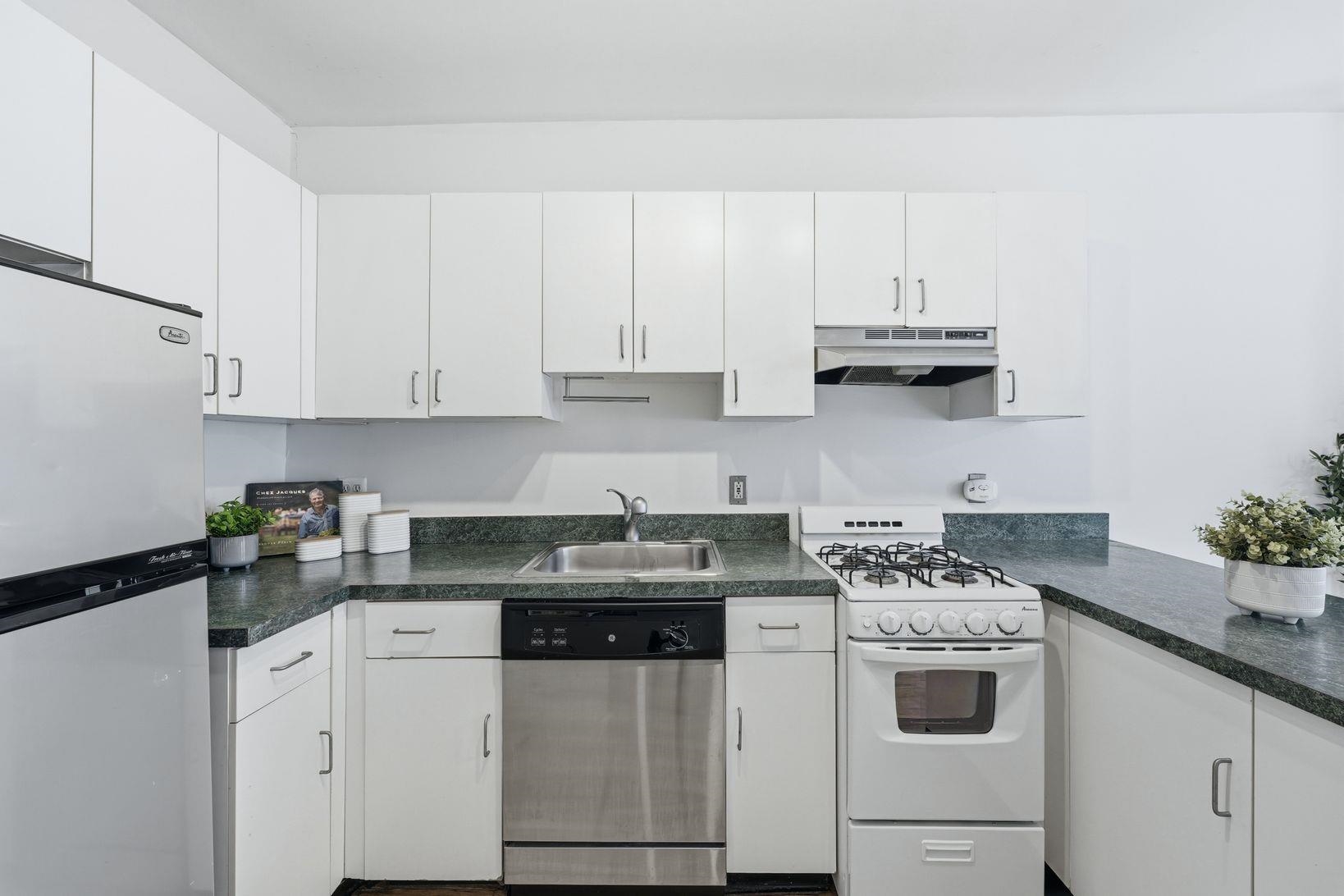 509 Monroe Street, Unit 3L Hoboken, NJ 07030 - Photo 9 of 18 a kitchen with appliances a sink and cabinets