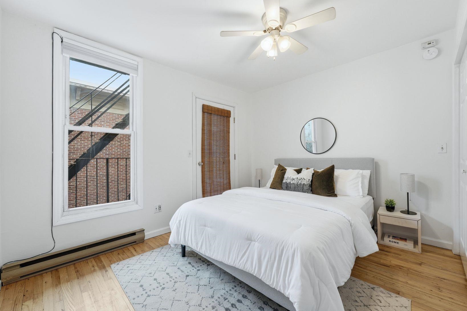 509 Monroe Street, Unit 3L Hoboken, NJ 07030 - Photo 10 of 18 a bedroom with a bed and a window