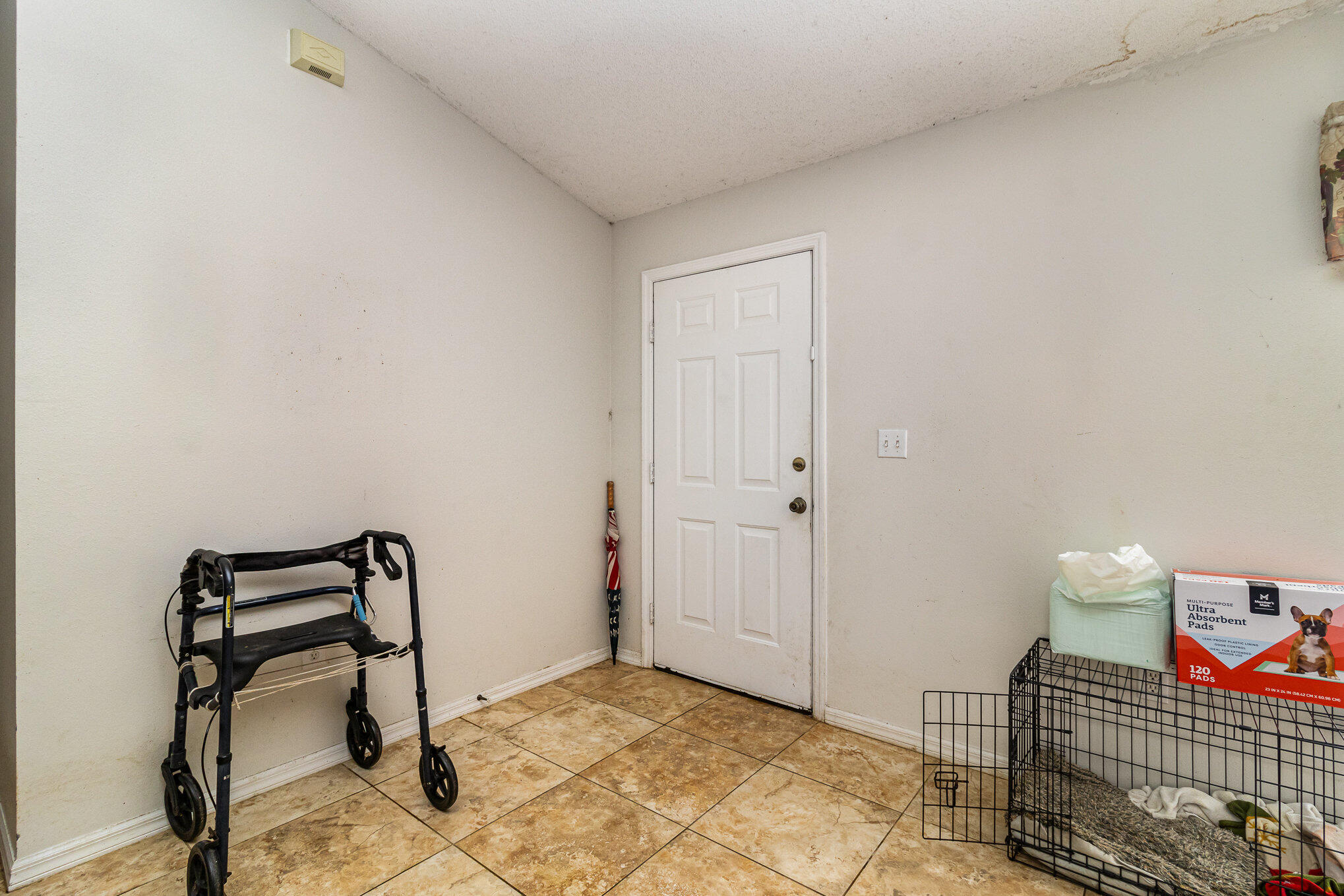 697 Furth Road Northwest Palm Bay, FL 32907 - Photo 5 of 24 a bedroom with a bed and a chair