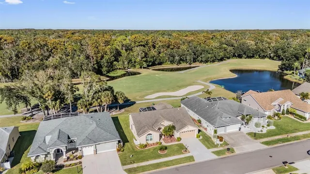 an aerial view of a house with outdoor space