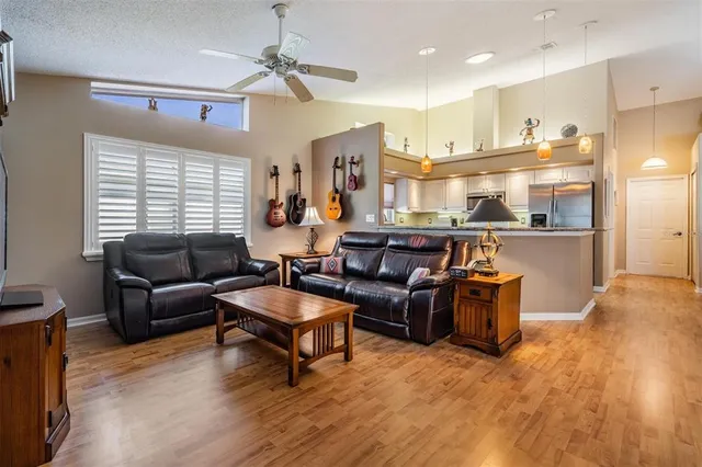 a living room with furniture and a large window
