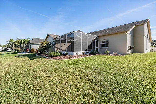 an aerial view of a house with a swimming pool
