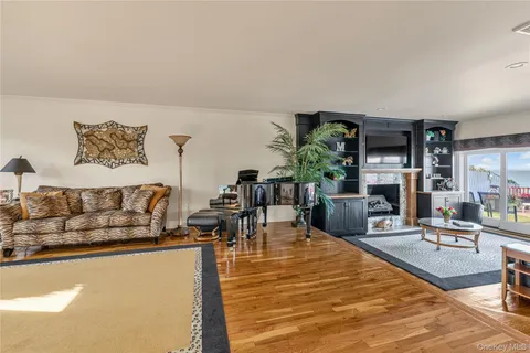 a living room with furniture fireplace and flat screen tv