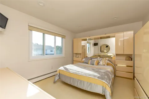 a bathroom with a granite countertop sink mirror and shower