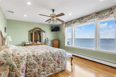 a bedroom with a large bed and a window