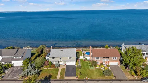 an aerial view of houses with outdoor space