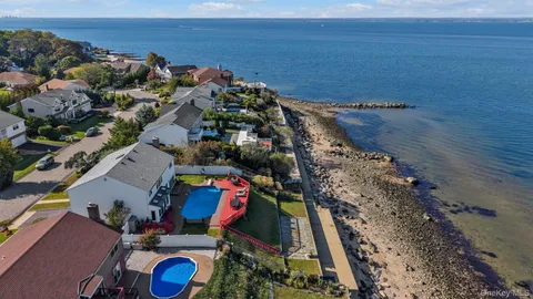 an aerial view of houses with outdoor space