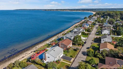 an aerial view of a house with swimming pool
