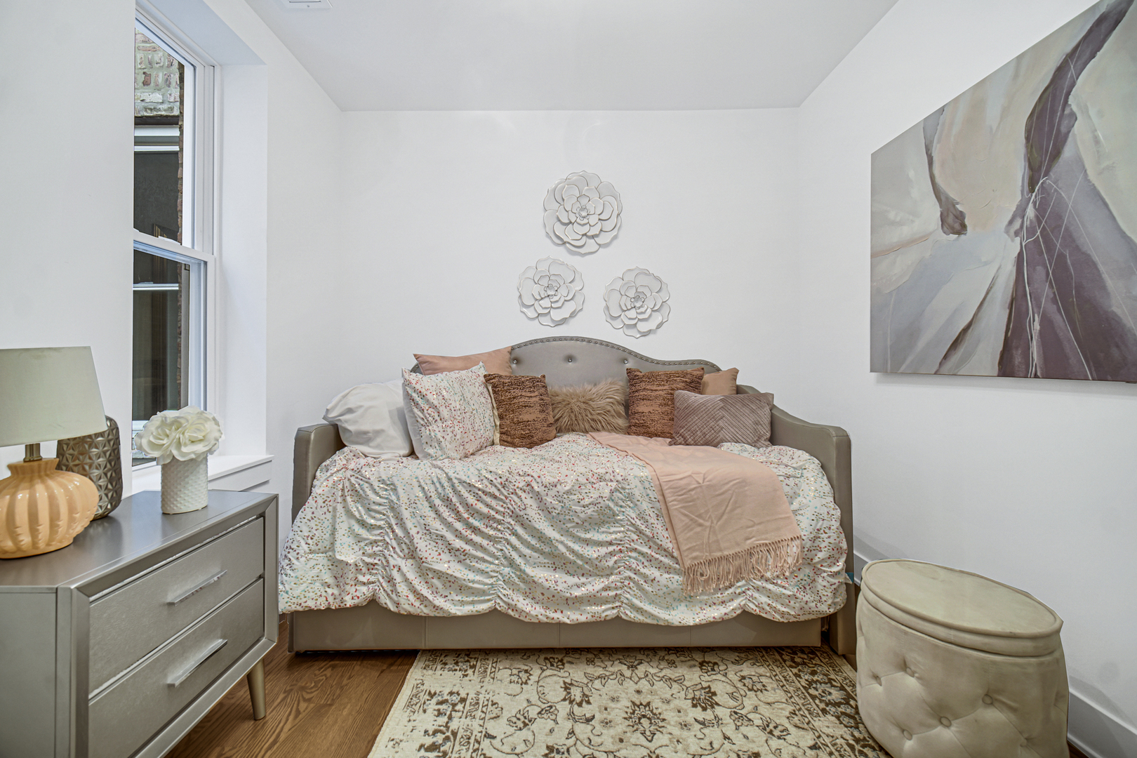 4559 South Michigan Avenue, Unit 2S Chicago, IL 60653 - Photo 12 of 26 a bedroom with a bed and a couch