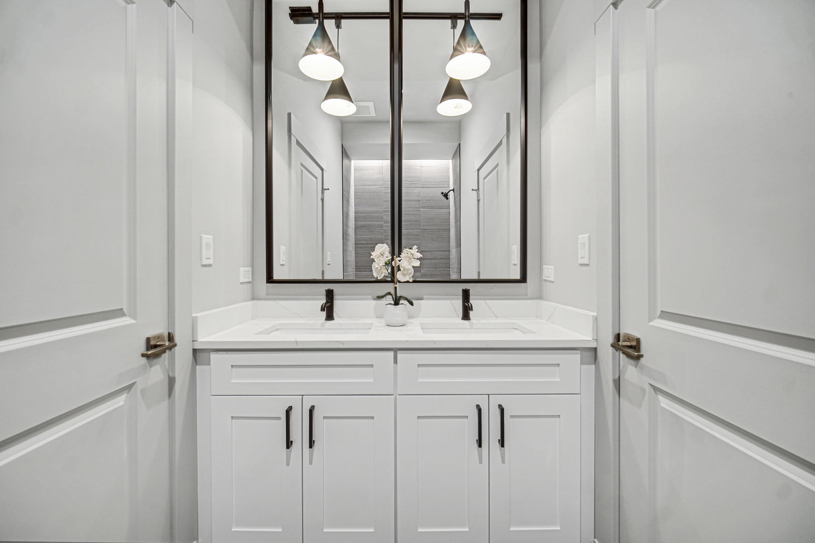 4559 South Michigan Avenue, Unit 2S Chicago, IL 60653 - Photo 13 of 26 a bathroom with a double vanity sink and mirror