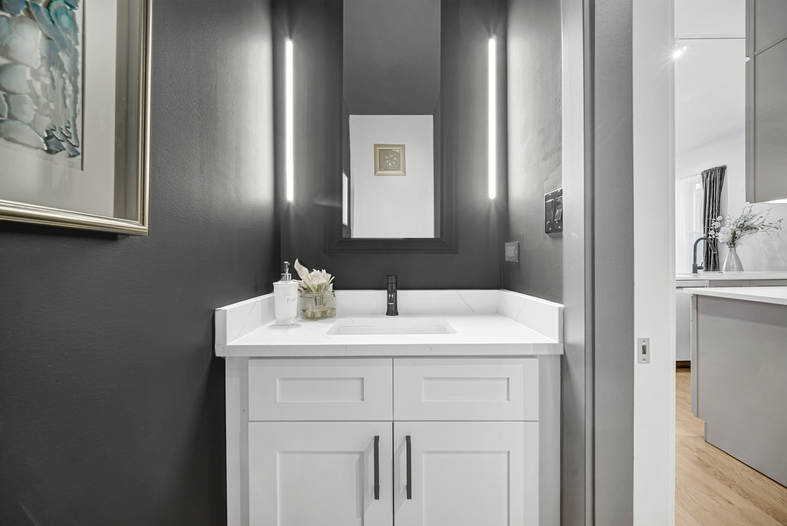 4559 South Michigan Avenue, Unit 2S Chicago, IL 60653 - Photo 15 of 26 a bathroom with a sink vanity and a mirror