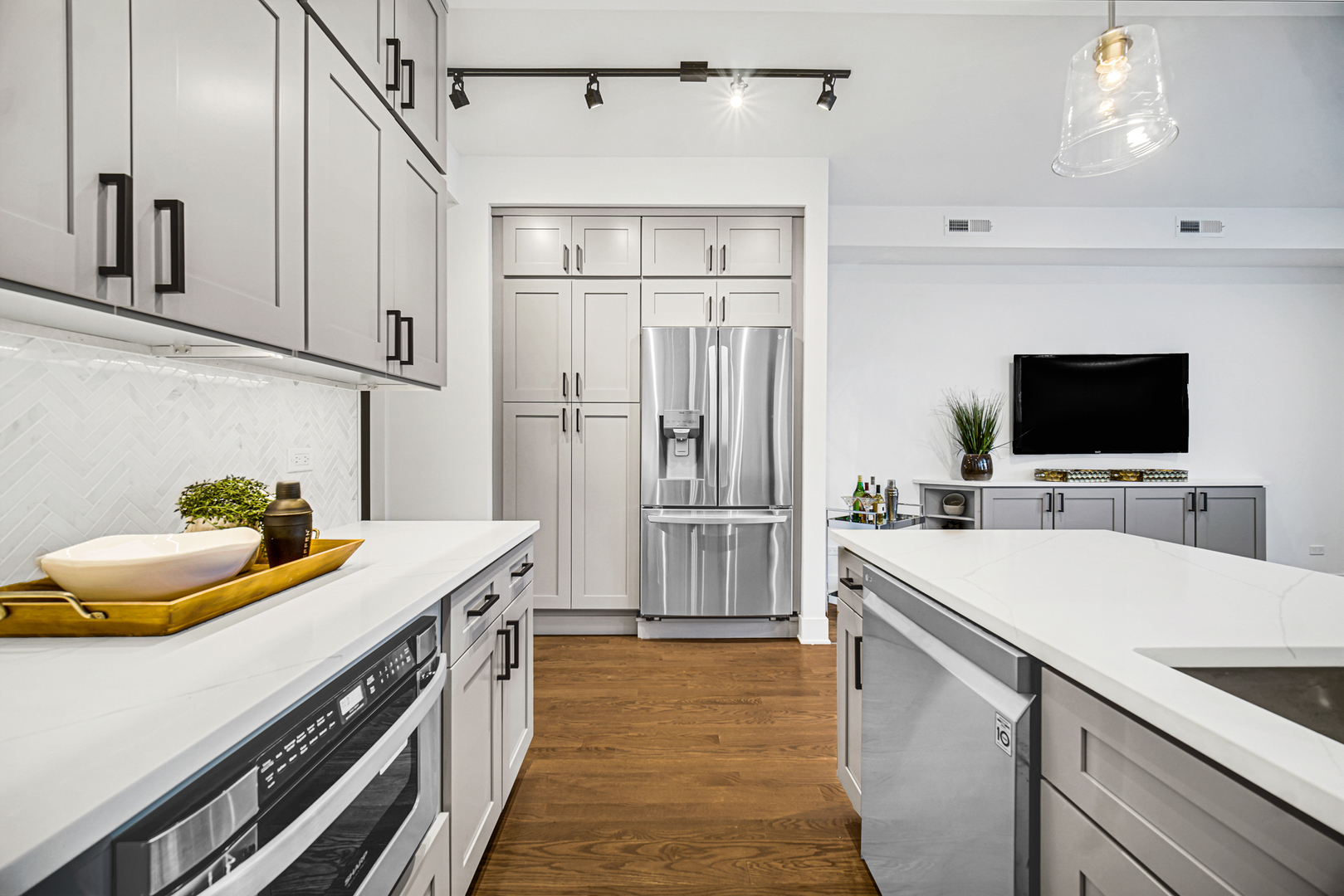4559 South Michigan Avenue, Unit 2S Chicago, IL 60653 - Photo 19 of 26 a kitchen with stainless steel appliances a sink and a refrigerator