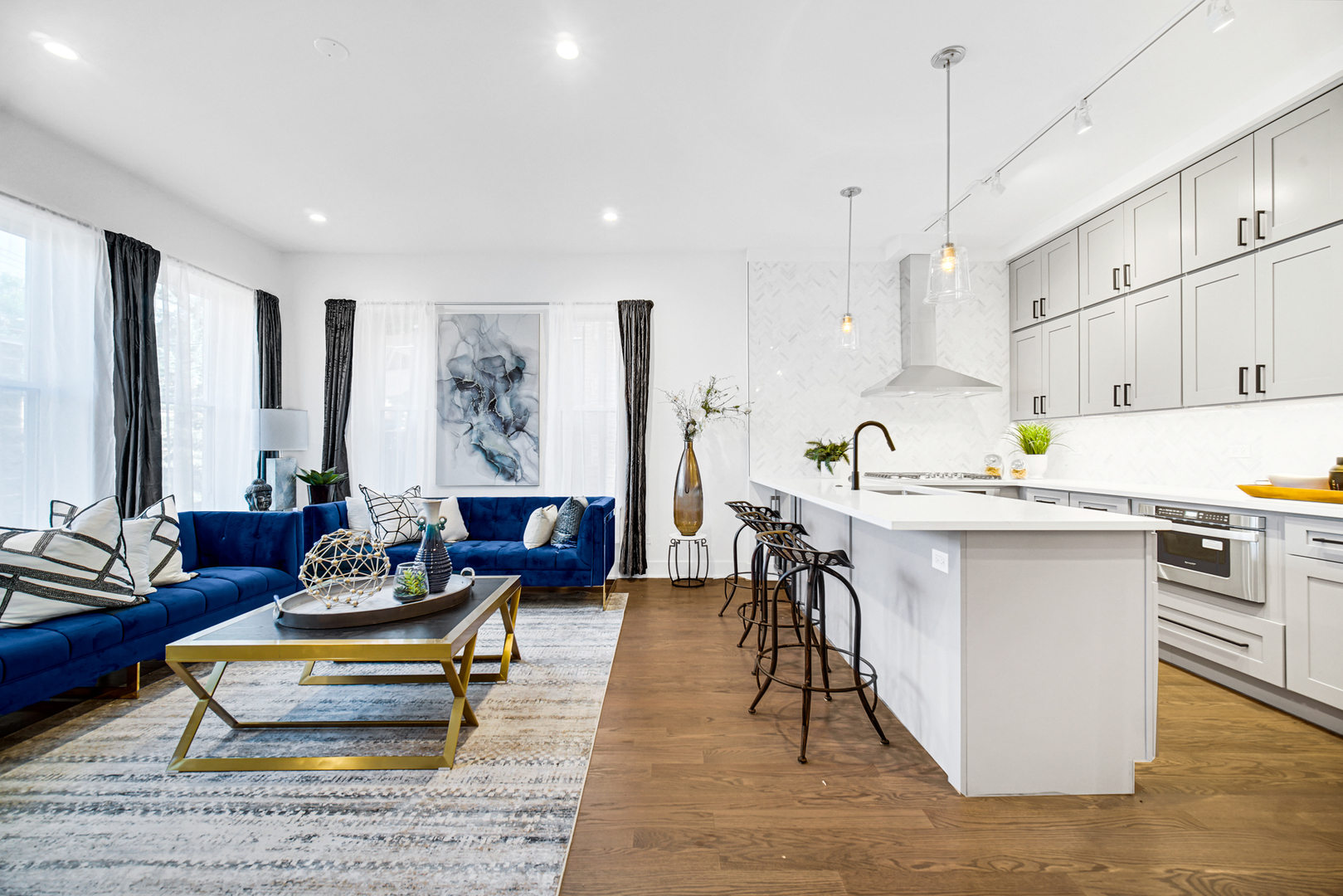 4559 South Michigan Avenue, Unit 2S Chicago, IL 60653 - Photo 21 of 26 a living room with kitchen island furniture and kitchen view