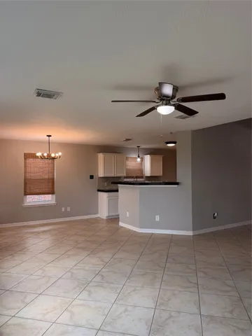 a view of a livingroom with a kitchen