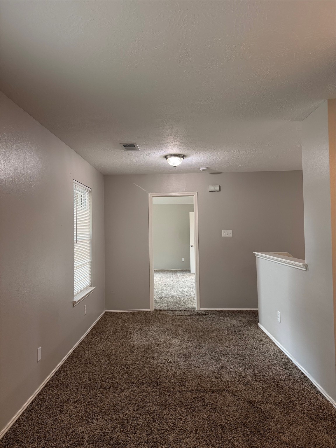 4707 East Parma Drive Rosenberg, TX 77471 - Photo 16 of 24 a view of an empty room and window